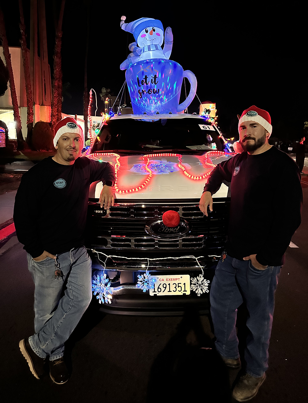 Leonardo Lopez, Utility Worker II (left) and Mario Ballejos, Utility Worker I (right) along with Eileen Salmeron, Communications Assistant, decorated the truck and the two utility workers drove the parade. It took three hours to decorate the vehicle. Photo: Otay Water District