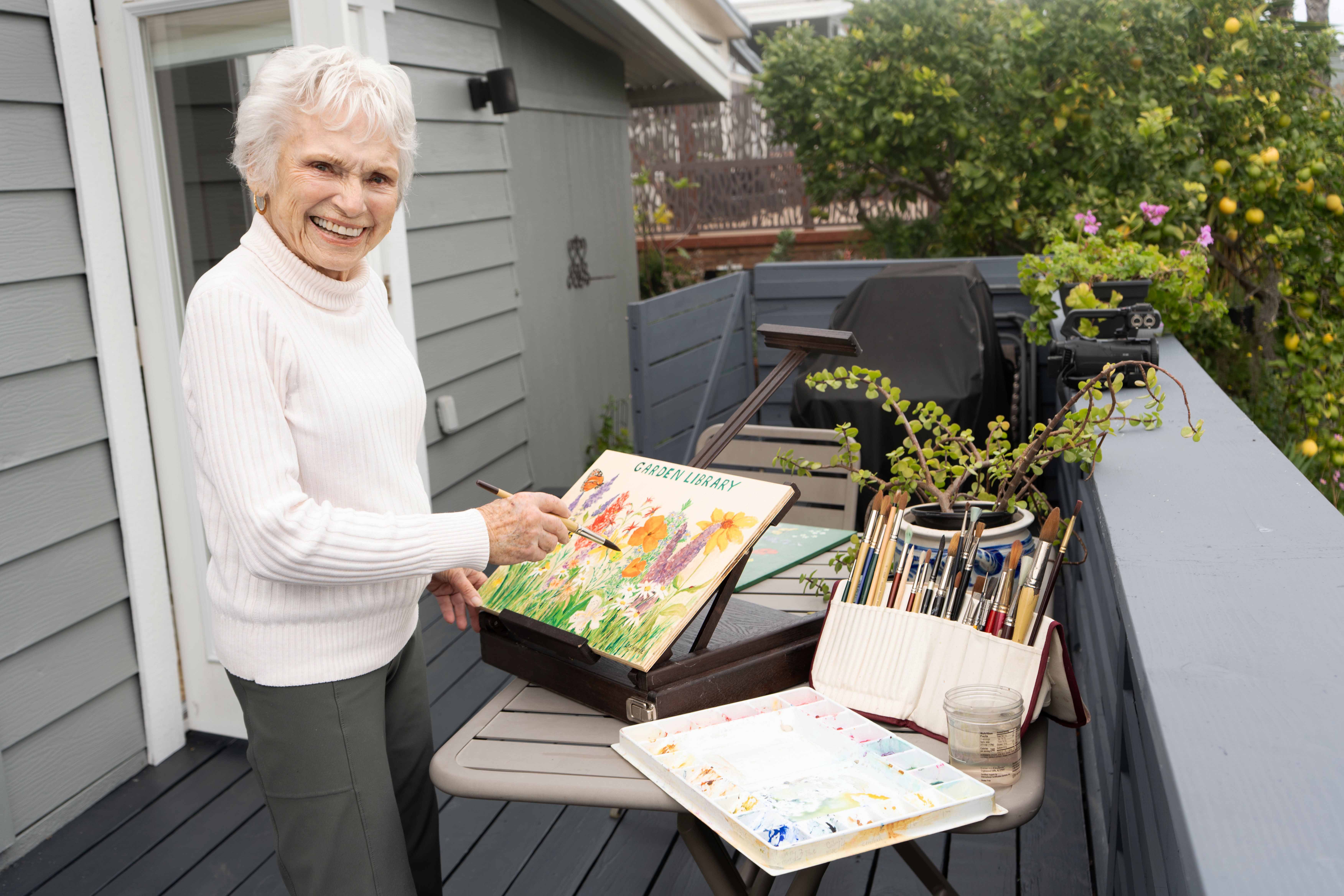 San Marcos painter and artist Ann Kreile is an avid gardener. who contributed her artwork for display in the Vallecitos Sustainable Demonstration Garden. Photo: Vallecitos Water District Sustainable Demonstration Garden