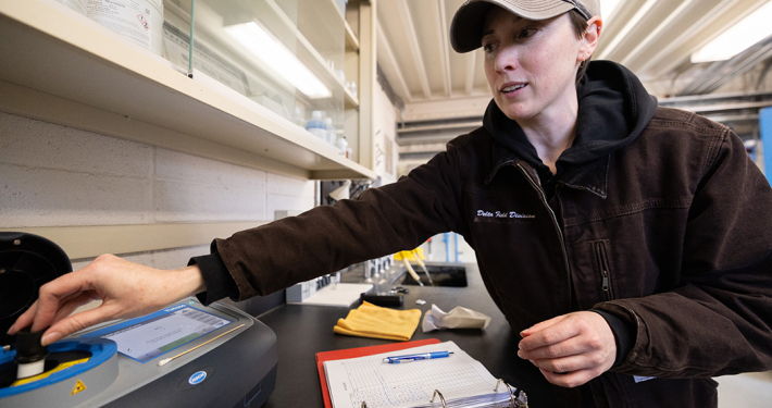 California Department of Water Resources Hydroelectric Plant Operator Apprentice Katie Swadener demonstrates how to monitor for water quality. Photo: Andrew Nixon / California Department of Water Resources