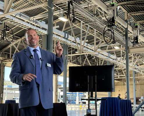 Helix Water District Kevin Miller highlights the new overhead EV charging infrastructure at the Nat L. Eggert Operations Center. Photo: San Diego County Water Authority