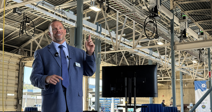 Helix Water District Kevin Miller highlights the new overhead EV charging infrastructure at the Nat L. Eggert Operations Center. Photo: San Diego County Water Authority