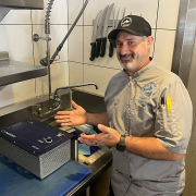 Bluewater Grill Executive Chief Albert Serrano with the CNSRV defrosting unit at his Carlsbad restaurant. Photo: San Diego County Water Authority