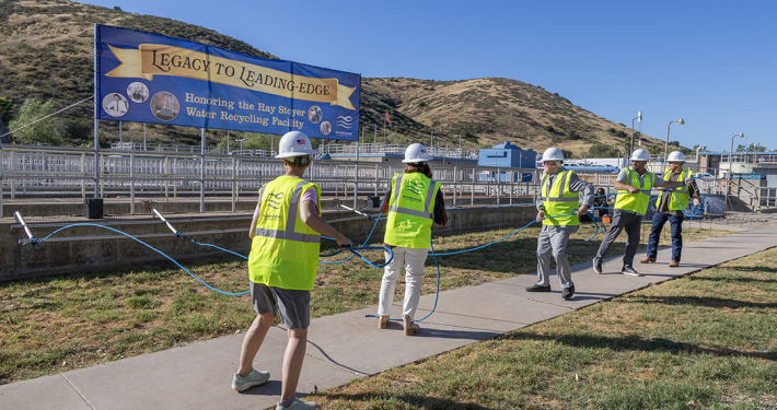 Padre Dam Municipal Water District’s board members pulled the railing of the aeration basin to mark the official decommissioning of the Ray Stoyer Water Recycling Facility. Photo: Padre Dam Municipal Water District