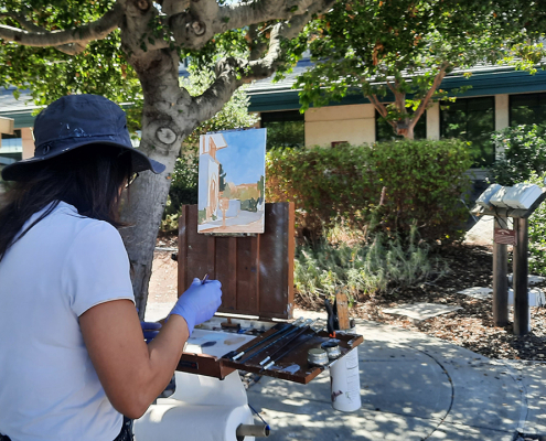 Artist Hailun Zhou works on her plein air painting at the Vallecitos Sustainable Demonstration Garden. Photo: Vallecitos Water District