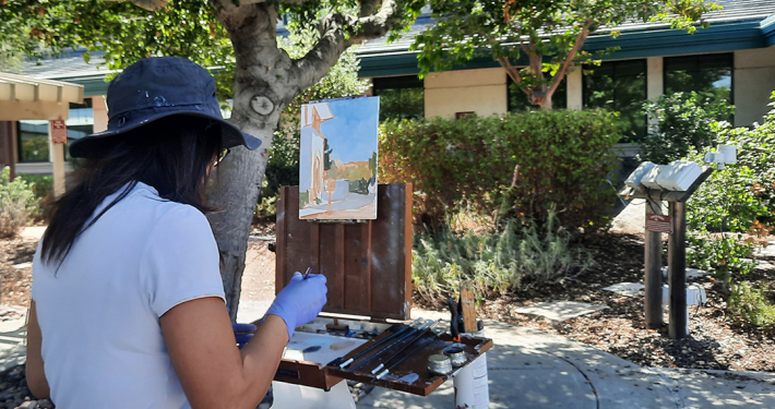 Artist Hailun Zhou works on her plein air painting at the Vallecitos Sustainable Demonstration Garden. Photo: Vallecitos Water District