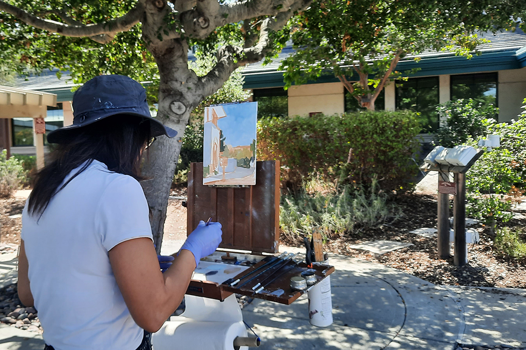 Artist Hailun Zhou works on her plein air painting at the Vallecitos Sustainable Demonstration Garden. Photo: Vallecitos Water District
