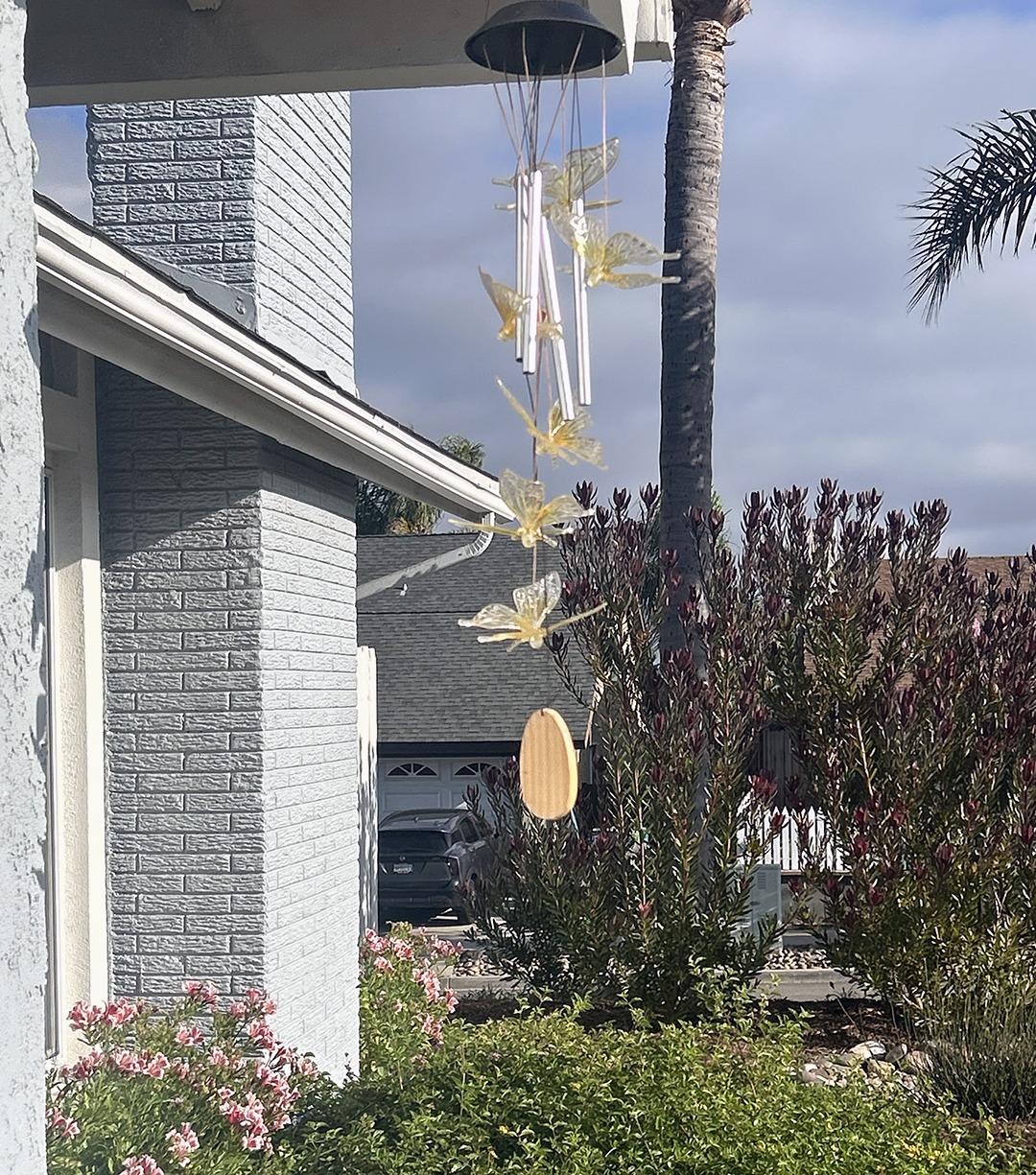Tom Watson hung butterfly wind chimes in honor of his late wife, Patti Watson. Photo: T. Watson. 2026 Oceanside Landscape winner